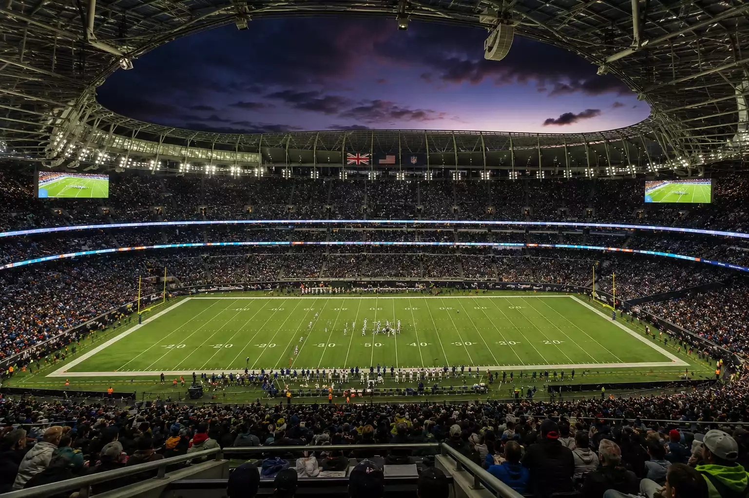 NFL London game at Wembley Stadium with a packed crowd of UK fans watching American football